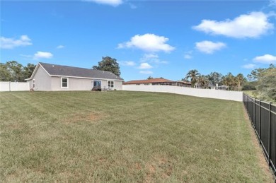 2021 CONCRETE BLOCK STUCCO BUILT HOME WITH 6 FOOT VINYL FENCED on Marion Oaks Country Club in Florida - for sale on GolfHomes.com, golf home, golf lot