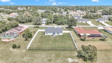 2021 CONCRETE BLOCK STUCCO BUILT HOME WITH 6 FOOT VINYL FENCED on Marion Oaks Country Club in Florida - for sale on GolfHomes.com, golf home, golf lot