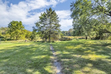 The original owner home offers a private backyard where you can on Hankerd Hills Golf Course in Michigan - for sale on GolfHomes.com, golf home, golf lot