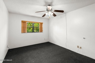 Welcome to an incredible opportunity to own an affordable on Daytona Beach Golf Club in Florida - for sale on GolfHomes.com, golf home, golf lot