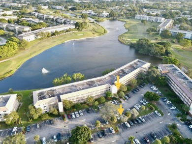 2/2 CONDO NESTLED ON THE WATER WITH LIGHTED FOUNTAIN GOLF VIEWS! on Wynmoor Golf Course in Florida - for sale on GolfHomes.com, golf home, golf lot