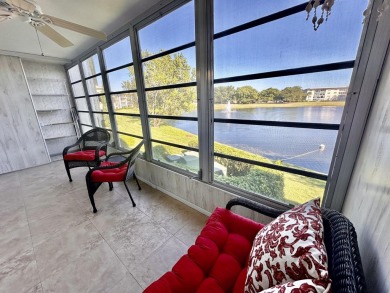 2/2 CONDO NESTLED ON THE WATER WITH LIGHTED FOUNTAIN GOLF VIEWS! on Wynmoor Golf Course in Florida - for sale on GolfHomes.com, golf home, golf lot