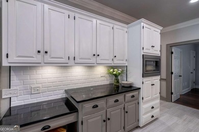 Welcome to 1291 Millstone Run, a stunning four bedroom, four on Jennings Mill Country Club in Georgia - for sale on GolfHomes.com, golf home, golf lot