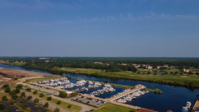 This beautiful home sits on a large lakefront lot in the Milano on Grande Dunes Golf Club in South Carolina - for sale on GolfHomes.com, golf home, golf lot
