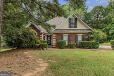 Welcome to this stately 4 bedroom, 2.5 bathroom traditional on Canongate At Georgia National Golf Club in Georgia - for sale on GolfHomes.com, golf home, golf lot