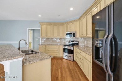 This thoughtfully designed home offers tranquil views of the on Members Club At St. James Plantation in North Carolina - for sale on GolfHomes.com, golf home, golf lot