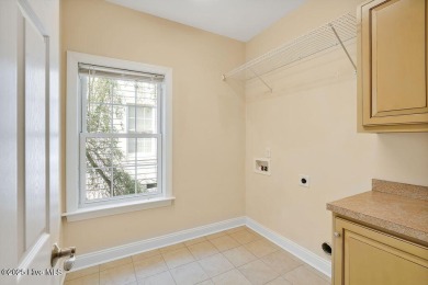 This thoughtfully designed home offers tranquil views of the on Members Club At St. James Plantation in North Carolina - for sale on GolfHomes.com, golf home, golf lot