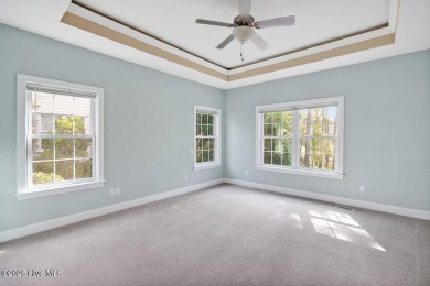This thoughtfully designed home offers tranquil views of the on Members Club At St. James Plantation in North Carolina - for sale on GolfHomes.com, golf home, golf lot
