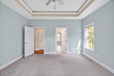 This thoughtfully designed home offers tranquil views of the on Members Club At St. James Plantation in North Carolina - for sale on GolfHomes.com, golf home, golf lot