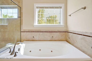 This thoughtfully designed home offers tranquil views of the on Members Club At St. James Plantation in North Carolina - for sale on GolfHomes.com, golf home, golf lot