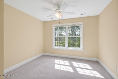 This thoughtfully designed home offers tranquil views of the on Members Club At St. James Plantation in North Carolina - for sale on GolfHomes.com, golf home, golf lot