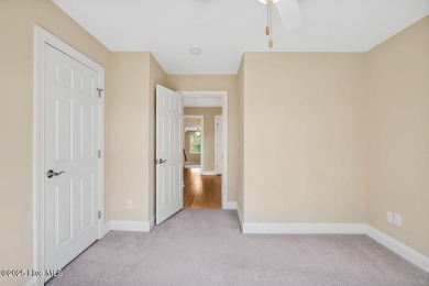 This thoughtfully designed home offers tranquil views of the on Members Club At St. James Plantation in North Carolina - for sale on GolfHomes.com, golf home, golf lot