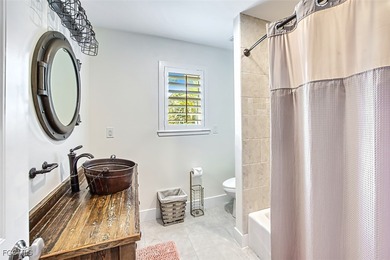 Discover this one-of-a-kind beach home that captures the true on Beachview Golf Club in Florida - for sale on GolfHomes.com, golf home, golf lot