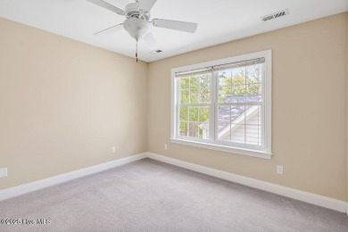 This thoughtfully designed home offers tranquil views of the on Members Club At St. James Plantation in North Carolina - for sale on GolfHomes.com, golf home, golf lot