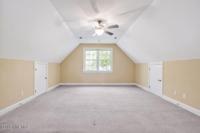 This thoughtfully designed home offers tranquil views of the on Members Club At St. James Plantation in North Carolina - for sale on GolfHomes.com, golf home, golf lot