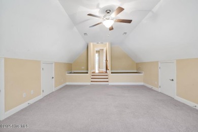 This thoughtfully designed home offers tranquil views of the on Members Club At St. James Plantation in North Carolina - for sale on GolfHomes.com, golf home, golf lot