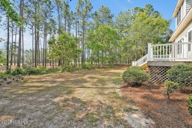 This thoughtfully designed home offers tranquil views of the on Members Club At St. James Plantation in North Carolina - for sale on GolfHomes.com, golf home, golf lot