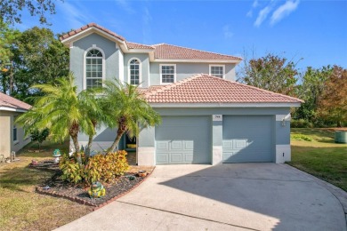 This light-filled home boasts beautiful views from the side of on Tuscawilla Country Club in Florida - for sale on GolfHomes.com, golf home, golf lot