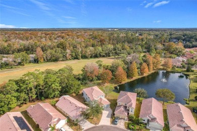 This light-filled home boasts beautiful views from the side of on Tuscawilla Country Club in Florida - for sale on GolfHomes.com, golf home, golf lot