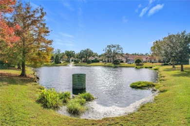 This light-filled home boasts beautiful views from the side of on Tuscawilla Country Club in Florida - for sale on GolfHomes.com, golf home, golf lot