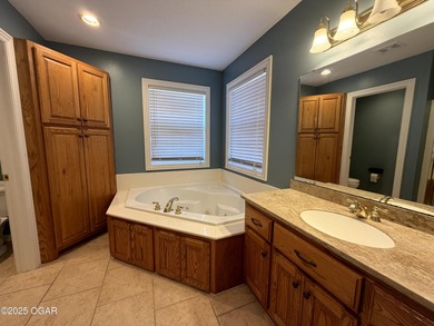 Welcome to this beautifully maintained 1.5-story home with a on Briarbrook Golf Course in Missouri - for sale on GolfHomes.com, golf home, golf lot