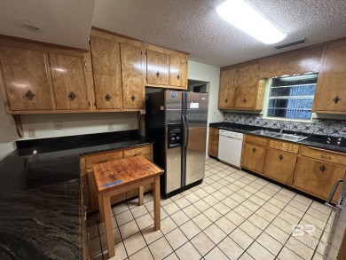 Spacious Gulf Shores Classic with Endless Potential! Discover on The Golf Club of the Wharf in Alabama - for sale on GolfHomes.com, golf home, golf lot