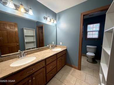 Welcome to this beautifully maintained 1.5-story home with a on Briarbrook Golf Course in Missouri - for sale on GolfHomes.com, golf home, golf lot