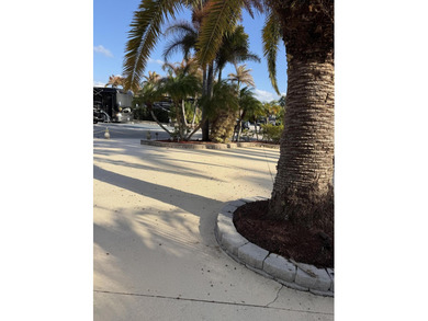 Huge lot in the MCRSLW Resort that backs to golf course. Mature on Motorcoach Resort Golf Course in Florida - for sale on GolfHomes.com, golf home, golf lot