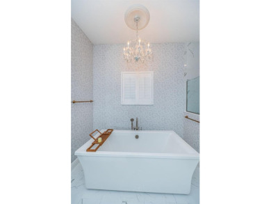 Welcome to your dream home, a stunning 4 BR, 3 bath luxury on Seven Springs Golf and Country Club in Florida - for sale on GolfHomes.com, golf home, golf lot