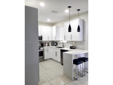 Beautiful and remodeled townhouse with 4 bedrooms and 3 full on Country Club of Miami in Florida - for sale on GolfHomes.com, golf home, golf lot