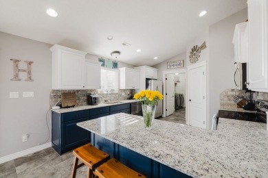 This stunning 4 bed, 2 bath home sits on a  1-acre corner lot on Spring Creek Golf Course in Nevada - for sale on GolfHomes.com, golf home, golf lot