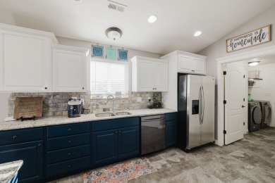 This stunning 4 bed, 2 bath home sits on a  1-acre corner lot on Spring Creek Golf Course in Nevada - for sale on GolfHomes.com, golf home, golf lot