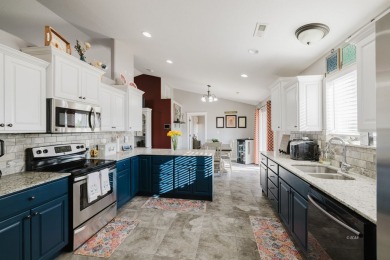 This stunning 4 bed, 2 bath home sits on a  1-acre corner lot on Spring Creek Golf Course in Nevada - for sale on GolfHomes.com, golf home, golf lot
