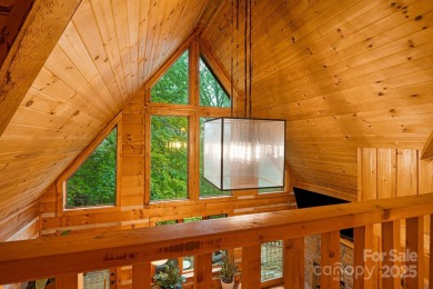 Prepare to fall in love with this beautifully updated mountain on Wolf Laurel Country Club in North Carolina - for sale on GolfHomes.com, golf home, golf lot