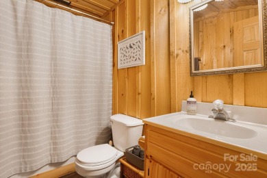 Prepare to fall in love with this beautifully updated mountain on Wolf Laurel Country Club in North Carolina - for sale on GolfHomes.com, golf home, golf lot
