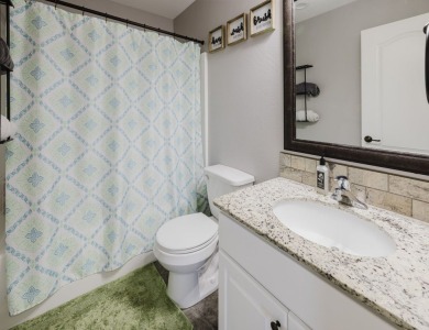 This stunning 4 bed, 2 bath home sits on a  1-acre corner lot on Spring Creek Golf Course in Nevada - for sale on GolfHomes.com, golf home, golf lot