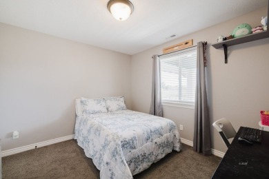 This stunning 4 bed, 2 bath home sits on a  1-acre corner lot on Spring Creek Golf Course in Nevada - for sale on GolfHomes.com, golf home, golf lot