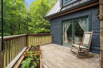 Prepare to fall in love with this beautifully updated mountain on Wolf Laurel Country Club in North Carolina - for sale on GolfHomes.com, golf home, golf lot