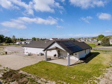This stunning 4 bed, 2 bath home sits on a  1-acre corner lot on Spring Creek Golf Course in Nevada - for sale on GolfHomes.com, golf home, golf lot
