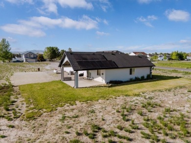 This stunning 4 bed, 2 bath home sits on a  1-acre corner lot on Spring Creek Golf Course in Nevada - for sale on GolfHomes.com, golf home, golf lot