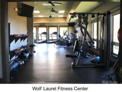 Fall in love with this beautifully updated mountain chalet on Wolf Laurel Country Club in North Carolina - for sale on GolfHomes.com, golf home, golf lot