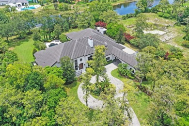 A modern French Chateau in Parkland's most exclusive enclave on Parkland Golf Club in Florida - for sale on GolfHomes.com, golf home, golf lot