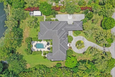 A modern French Chateau in Parkland's most exclusive enclave on Parkland Golf Club in Florida - for sale on GolfHomes.com, golf home, golf lot