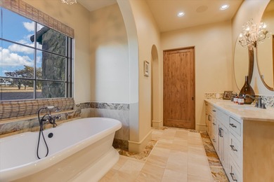 Nestled within the highly exclusive Escondido Golf & Lake Club on Escondido Golf and Lake Club  in Texas - for sale on GolfHomes.com, golf home, golf lot