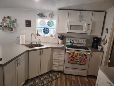 Welcome Home!!! This 2 bedroom 2 bath home is situated on the on Spanish Lakes Country Club in Florida - for sale on GolfHomes.com, golf home, golf lot