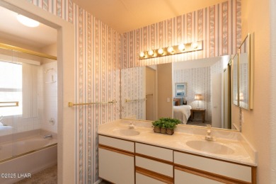 This fully furnished 2 bed, 3 bath condo is perfectly positioned on London Bridge Golf Course in Arizona - for sale on GolfHomes.com, golf home, golf lot