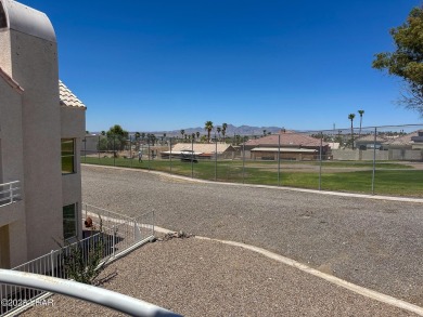 This fully furnished 2 bed, 3 bath condo is perfectly positioned on London Bridge Golf Course in Arizona - for sale on GolfHomes.com, golf home, golf lot
