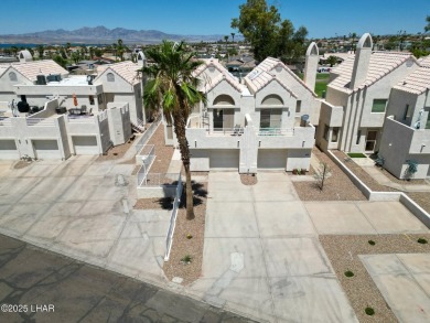 This fully furnished 2 bed, 3 bath condo is perfectly positioned on London Bridge Golf Course in Arizona - for sale on GolfHomes.com, golf home, golf lot