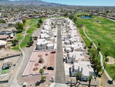 This fully furnished 2 bed, 3 bath condo is perfectly positioned on London Bridge Golf Course in Arizona - for sale on GolfHomes.com, golf home, golf lot