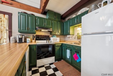 Nestled in the heart of the Laurel Highlands, this 3-bedroom on Kings Mountain Golf Course in Pennsylvania - for sale on GolfHomes.com, golf home, golf lot